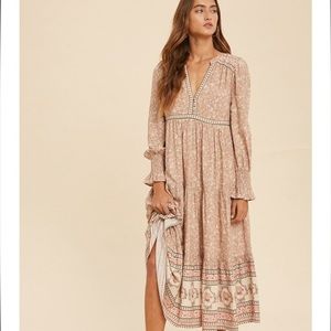 A boho maxi dress -V-neck
- Long sleeves with smocked ruffle wrist detail